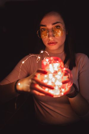 Woman in sunglasses with lamp