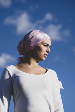 Young woman with cancer bandana