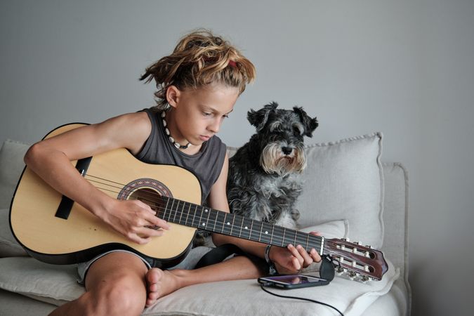Child playing the guitar