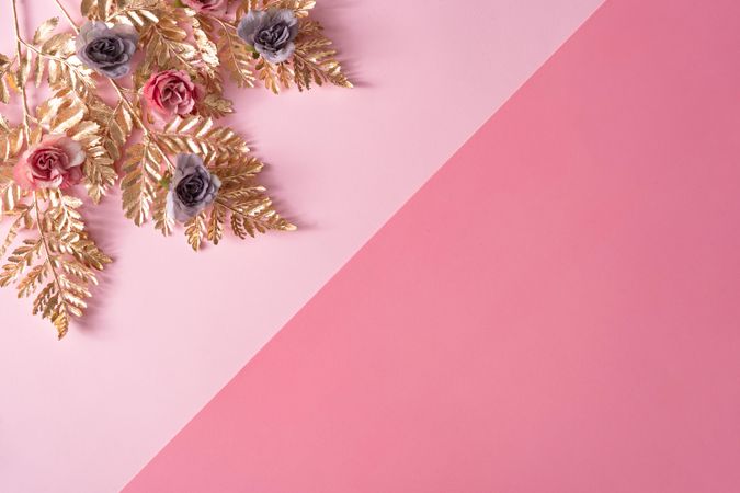 Layout made with pastel pink and purple flowers and gold leaves