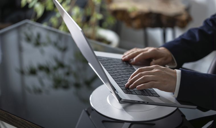 Businessman Working on Laptop at Office Desk
