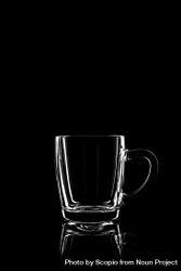 Clear glass mug with dark background 0vLxL4