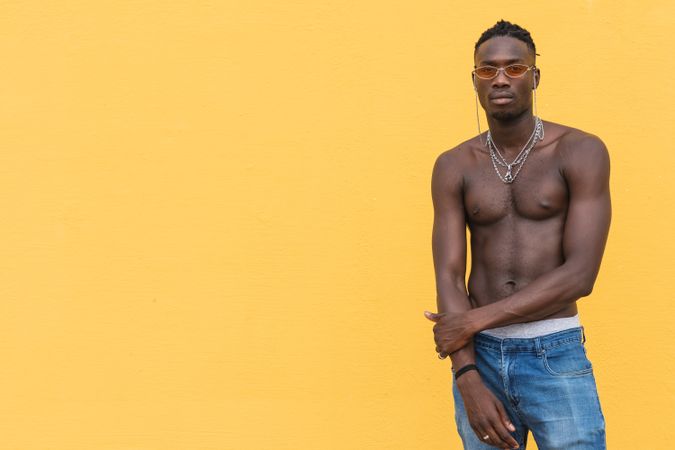 Serious Black man posing near wall