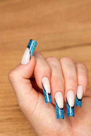 Chic Nail Art with Blue Glitter Detail