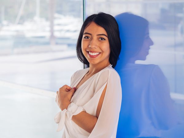 Young woman in beautiful dress smiling
