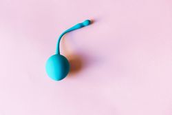 Kegel ball on dusty pink background