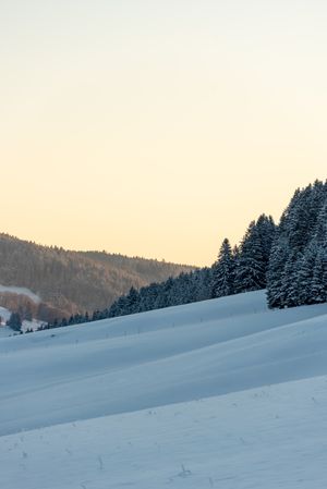Winter sunrise in the snowy mountains, in Germany