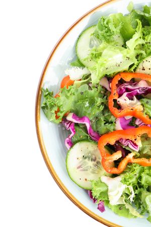 Plate with fresh salad isolated on plain background