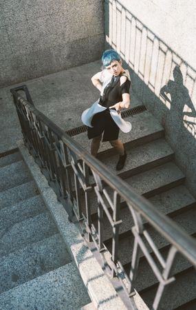 Sensual futuristic model posing on stairs