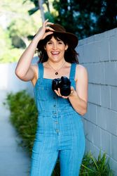 Laughing transgender woman holding camera