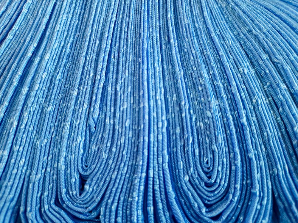 Folded blue curtain fabric