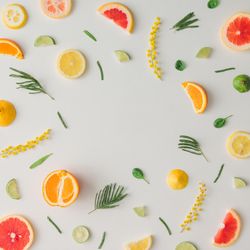 Colorful vegetable pattern made of lemon, grapefruit, lime and yellow flowers
