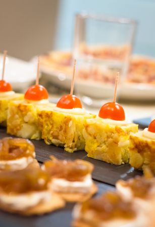 Spanish omelet tapas and cheese with onion pinchos