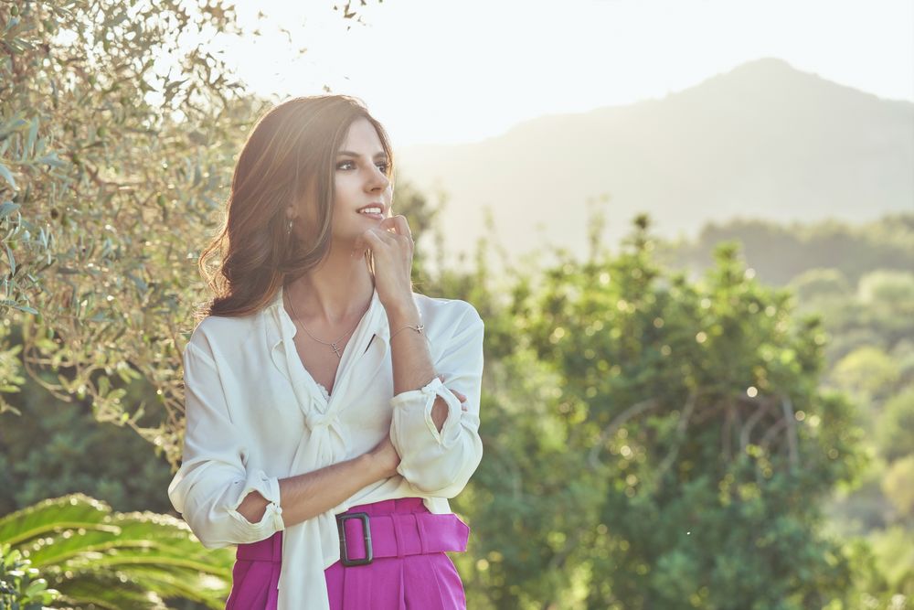 Charming woman standing in nature