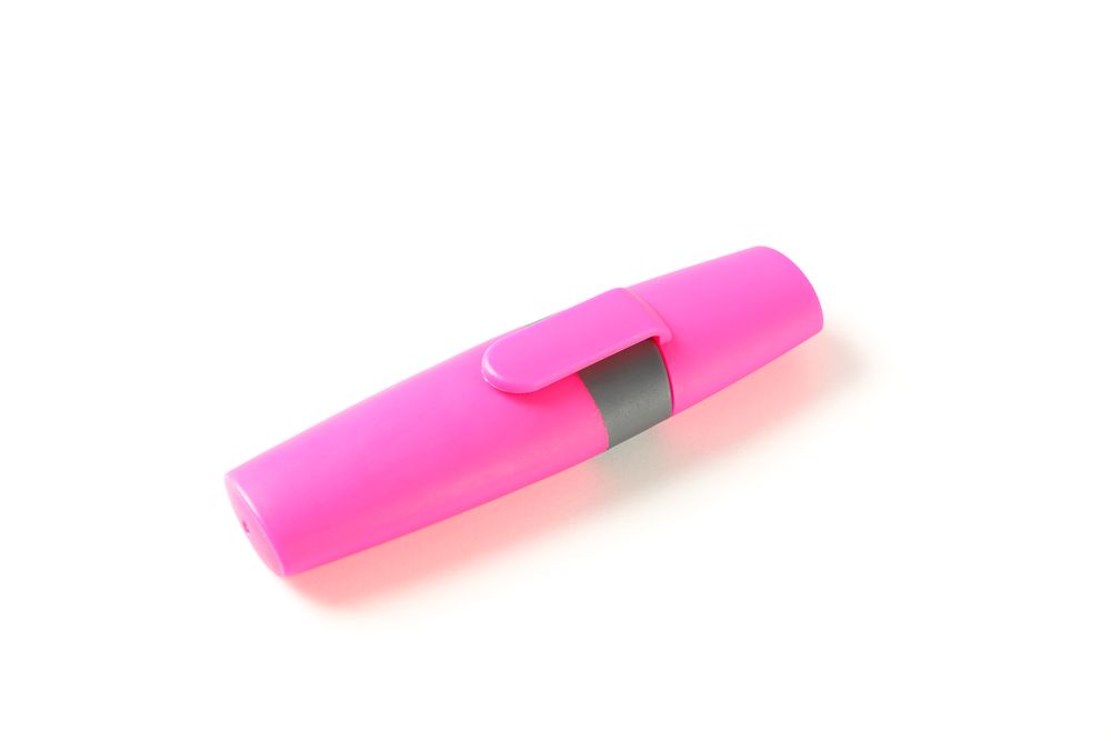 Color office highlighter isolated on plain background