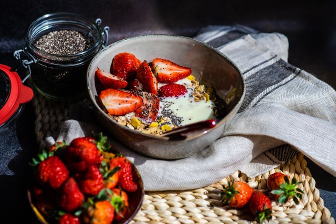 Bowl of oatmeal, chia seeds and strawberry with copy space