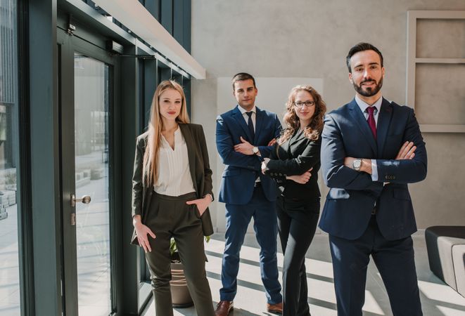 Business colleagues standing with crossed arms