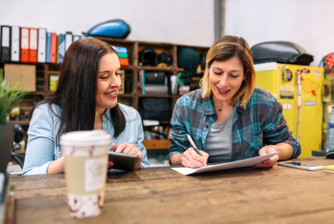Cheerful females entrepreneur working in a small business to sell through online ecommerce