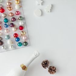 Bauble decorations ordered in box with bottle of Champagne