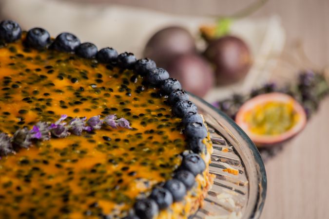 Tasty passion fruit pie decorated with blueberry