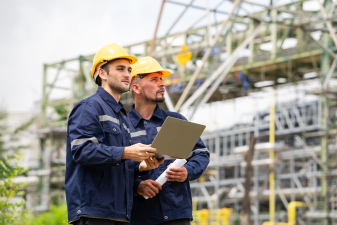 Engineer worker checking project at petrochemical factory or refinery oil plant industrial.