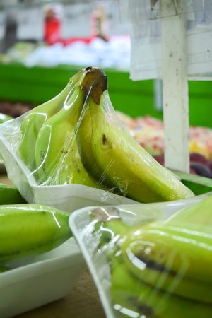 Banana fruits wrapped and for sale in market