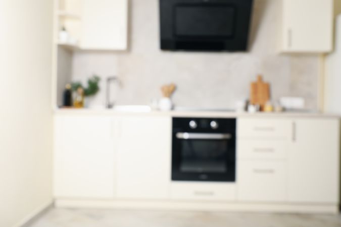 Modern kitchen interior with different supplies in light colors