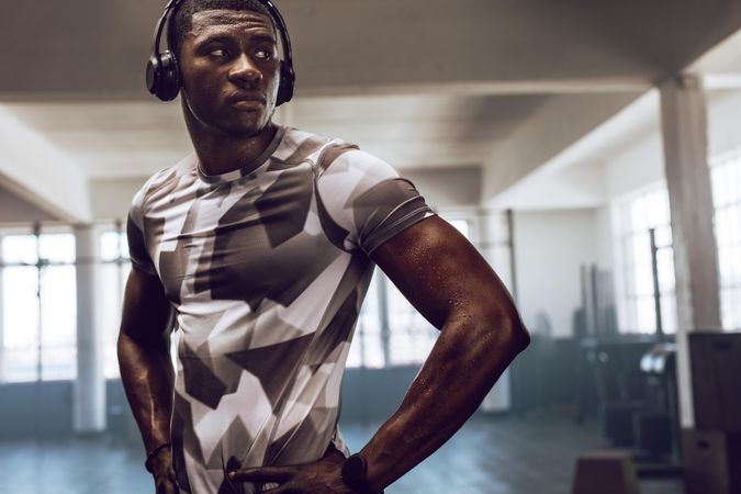 Man training at the gym wearing headphones