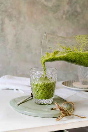 serving a homemade healthy smoothie detox