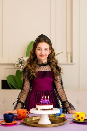 Girl in elegant dress celebrates birthday