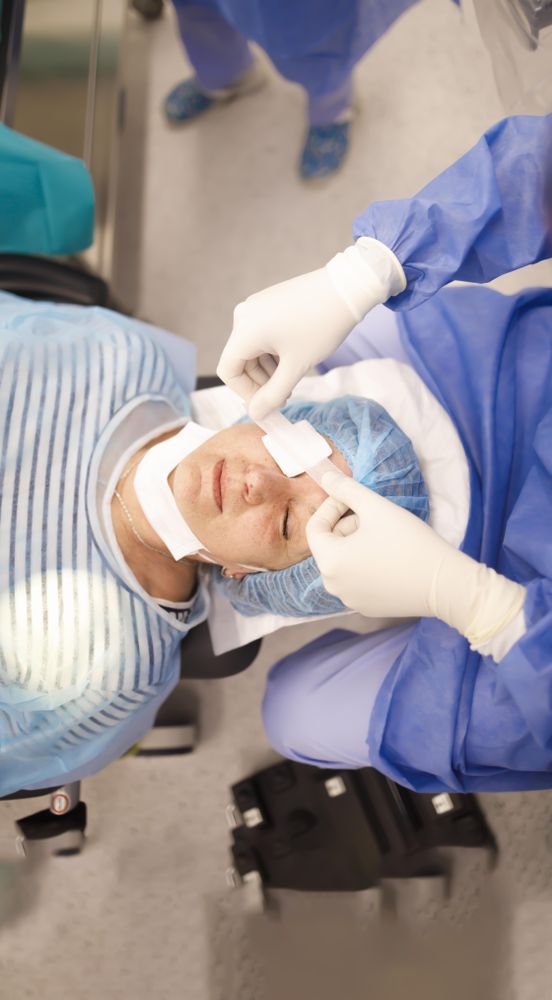 Looking down at older woman in cataract surgery