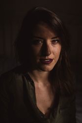 Female in dark room