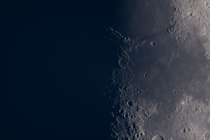 Close-up view of the moon's craters along lunar terminator.