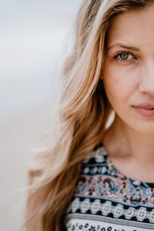 Crop of half face of young woman