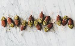 Ice cream chocolate pistachio popsicles, light background, top view