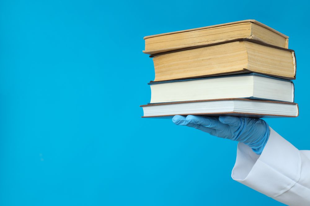 Concept of medical education and books, space for text