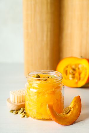 Skin care and face care concept - pumpkin cosmetic