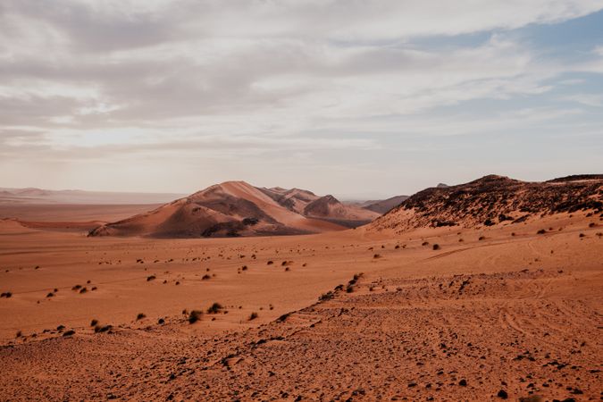 Sunset sky over hills in desert