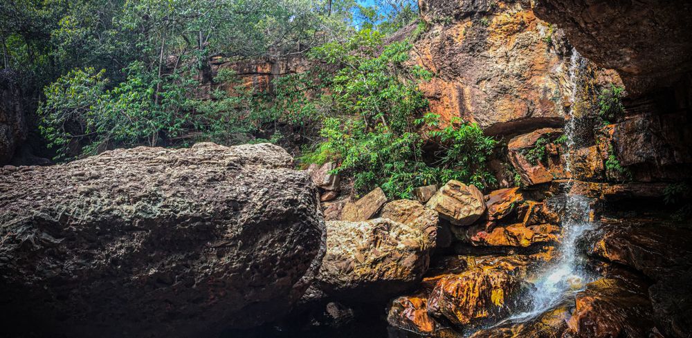 Small waterfall in rugged terrain