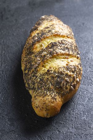 Loaf of bread with grains and poppy seeds