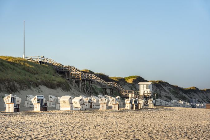 Beach chairs on the beach in the sunrise