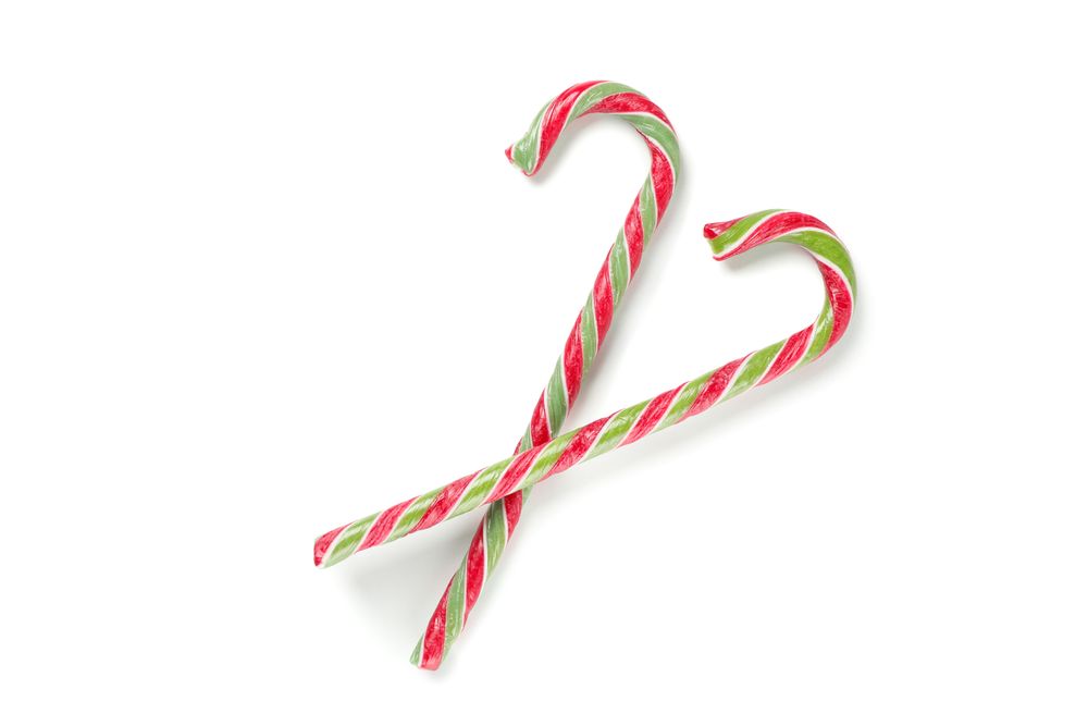 Sweet candy canes isolated on blank background