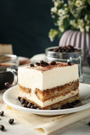 Composition with tasty tiramisu on blank wooden background. Delicious dessert