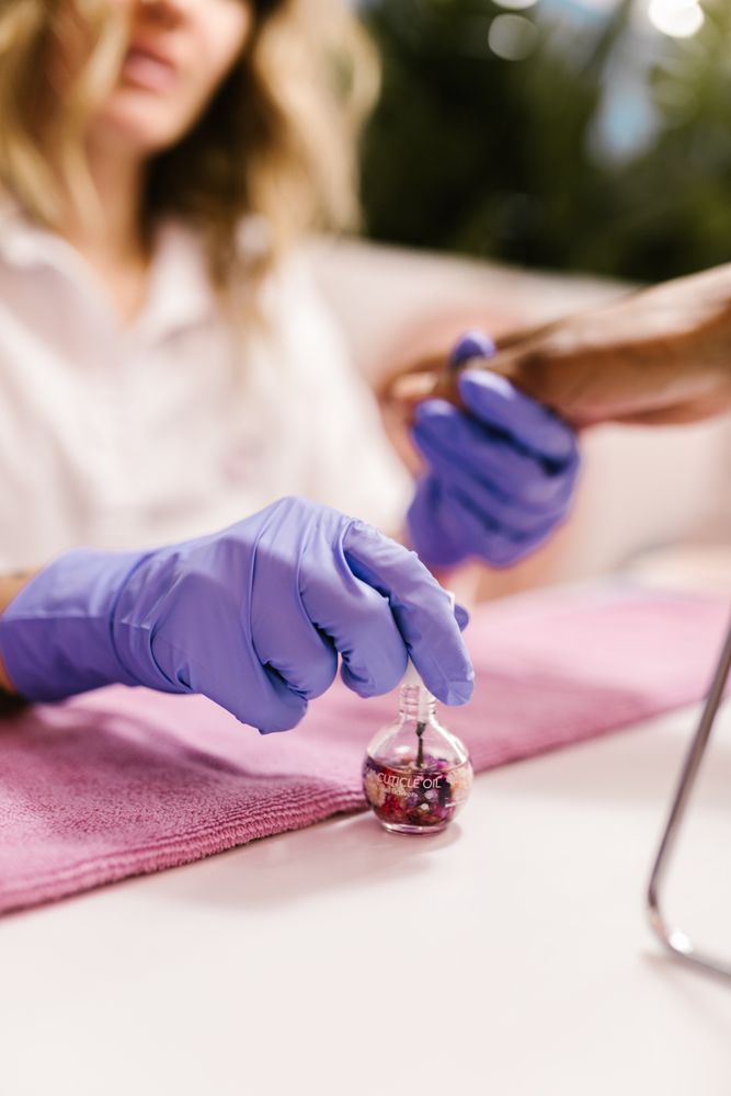 Cropped image of manicurist holding a hand