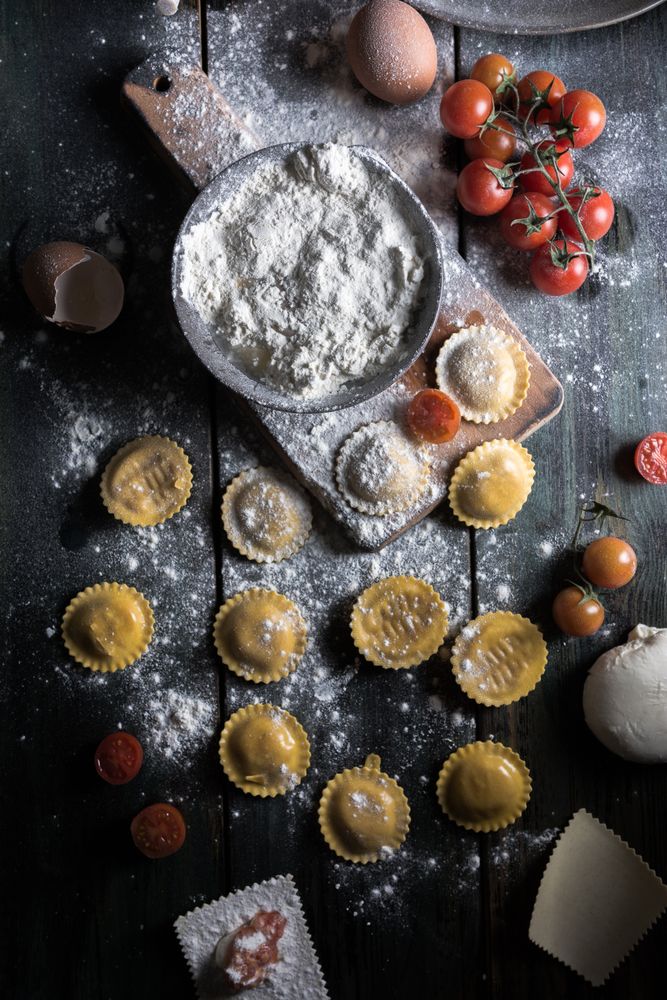 Homemade ravioli made with parmesan cheese, tomato and basil.