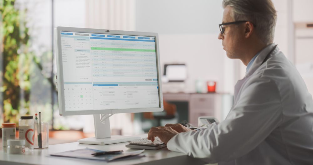 Medical Health Care Professional Working with Test Results, Patient Treatment Planning