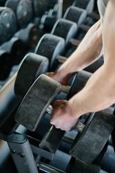 Person holding heavy dumbbell 41A7O4