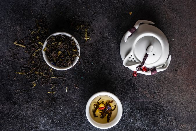 Top view of loose leaf tea with tea pot