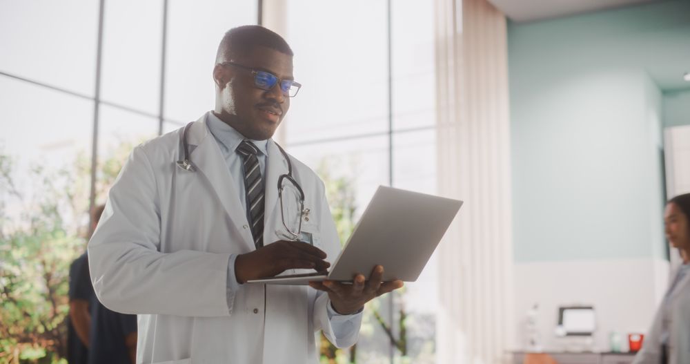 Black Medical Health Care Professional Working with Patient Test Results