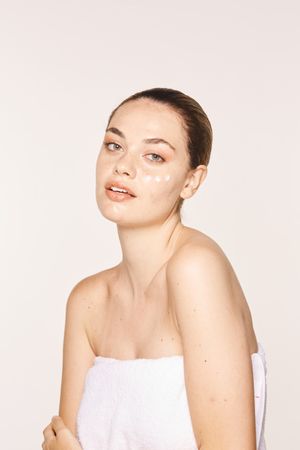 woman with cream on face